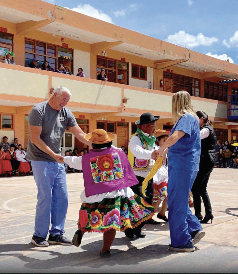 Providers and other people dancing in an open area